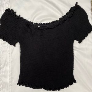 Black off the shoulder lettuce hem top